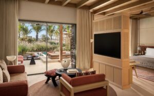 Suite living area opening to a private pool at Six Senses AMAALA
